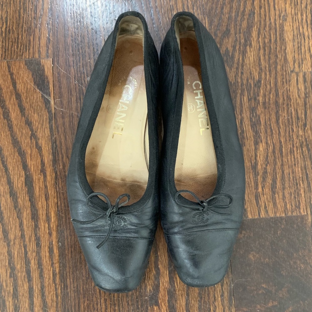 Chanel black leather flats
